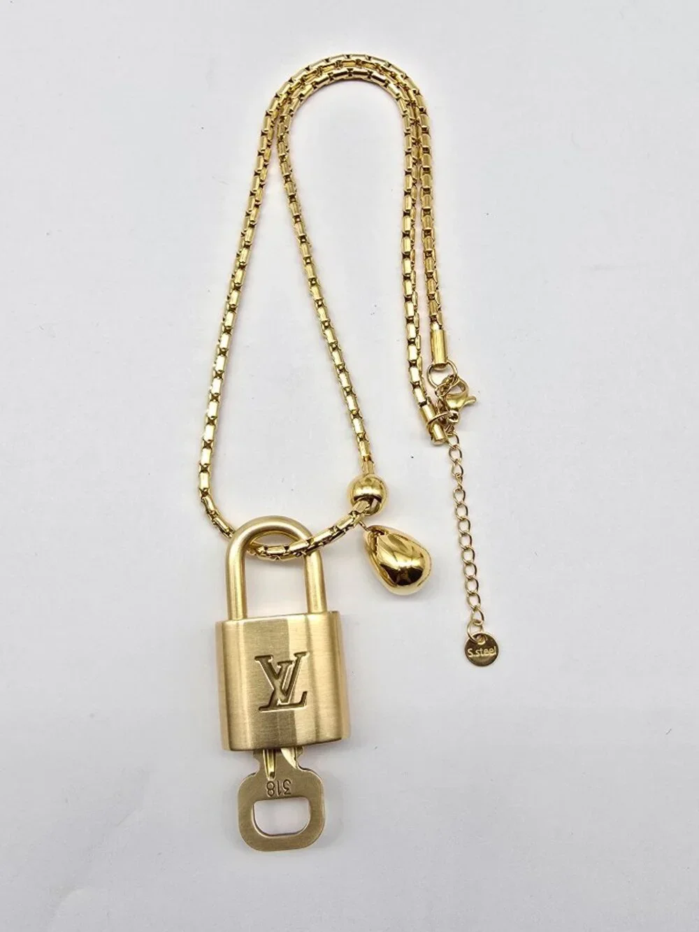 ✨ Stainless Steel Gold-Plated Necklace with Authentic Louis Vuitton Padlock ✨